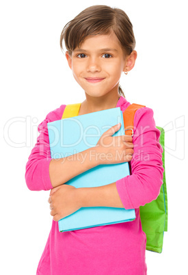 Young girl is holding book