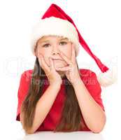 Young unhappy girl in christmas cloth
