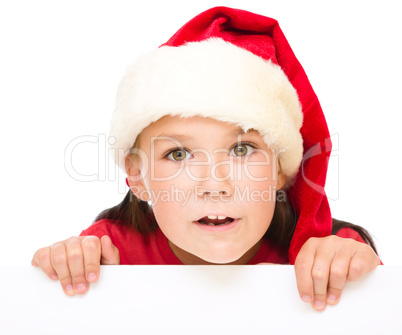 Little girl is holding blank board