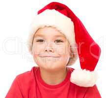 Portrait of a cute little girl in santa hat