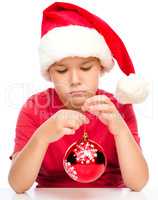 Young unhappy girl in christmas cloth