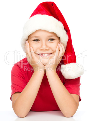 Portrait of a cute little girl in santa hat