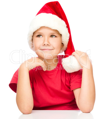 Portrait of a cute little girl in santa hat