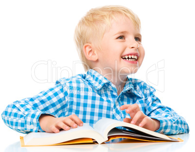 Little child play with book