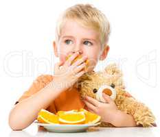 Portrait of a little boy with his teddy bear