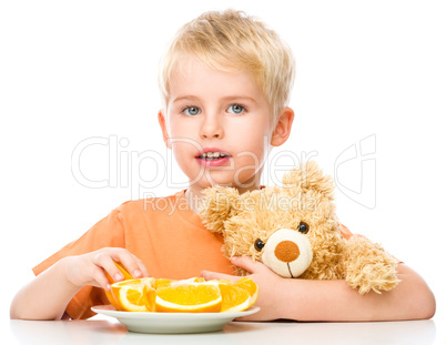 Portrait of a little boy with his teddy bear