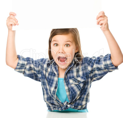 Little girl is holding a blank banner