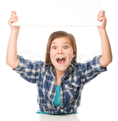 Little girl is holding a blank banner