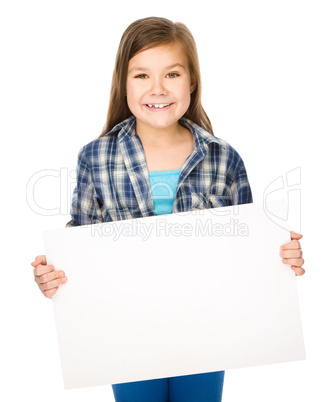 Little girl is holding a blank banner