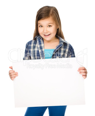 Little girl is holding a blank banner