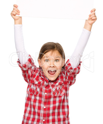 Little girl is holding a blank banner