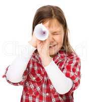 Cute little girl is looking through spyglass