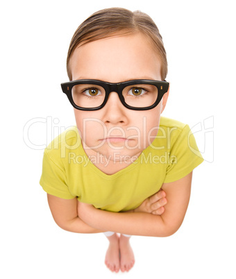 Portrait of a sad little girl wearing glasses