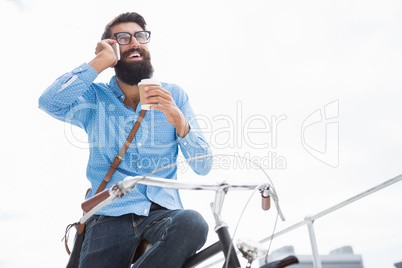 Hipster calling someone