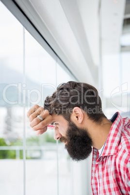 Hipster man looking outside