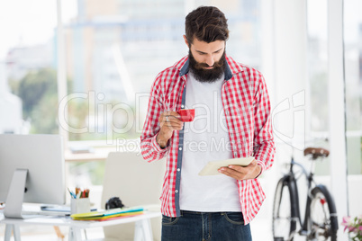 Hipster man looking on his notes