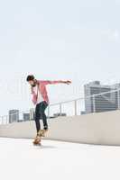 Hipster man doing skateboard