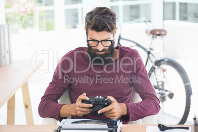 Hipster man using a typewriter