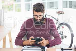 Hipster man using a typewriter