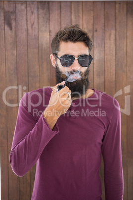 Hipster man smoking the pipe