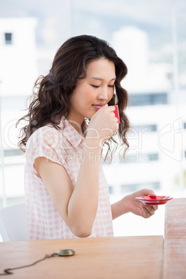 Hipster woman drinking a coffee