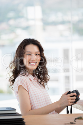 Hipster woman posing with her camera