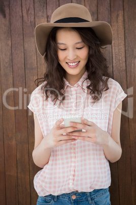 Hipster woman texting someone