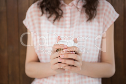 Hipster woman holding a coffee