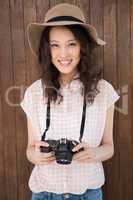 Hipster woman posing with her camera