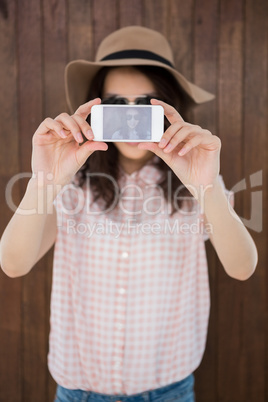 Hipster woman taking a picture