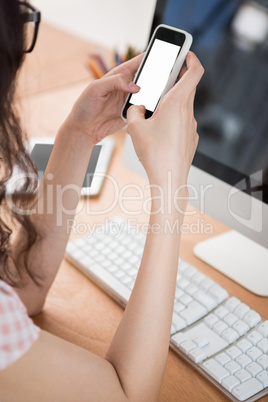 A business woman is using her phone