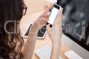 A woman is using her smartphone