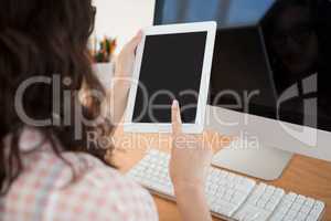 A business woman is using a touchpad