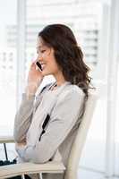 A businesswoman has a phone call