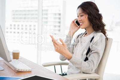 A businesswoman has a phone call