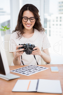 A businesswoman is checking pictures