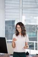 A business woman is using her phone