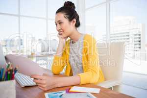 A businesswoman is looking at her computer