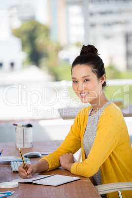 a businesswoman is sitting at her desk