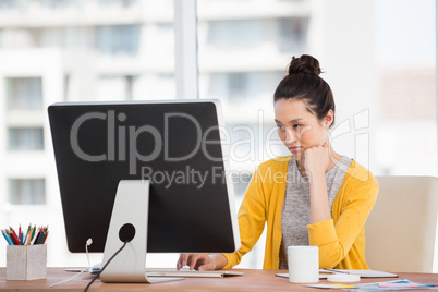 A beautiful businesswoman at her desk