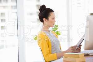 A beautiful businesswoman reading documents