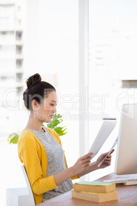 A beautiful businesswoman reading documents