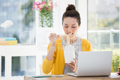 hipster girl eating at work