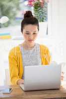 A business woman is working on her laptop