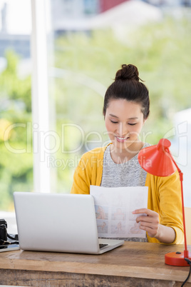 Hipster sitting in front of a laptop