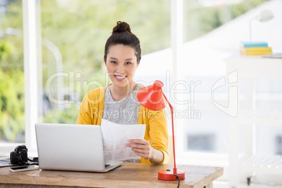 Hipster sitting in front of a laptop