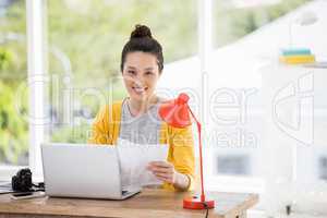 Hipster sitting in front of a laptop