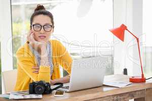 Hipster sitting in front of a laptop