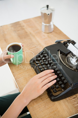 Hipster using type writer