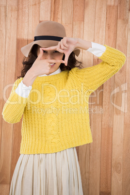 Hipster making a sign with her fingers